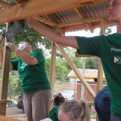 Projects Abroad volunteers building a playhouse for a local school as part of their building volunteer work in Jamaica A team from Projects Abroad take part in construction volunteering in Jamaica to build playhouse for local school